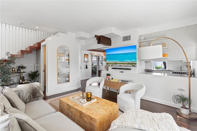 760 Meridian Ave Unit 1, Miami Beach, FL 33139 - living area with wood finished floors, visible vents, baseboards, and a wealth of natural light