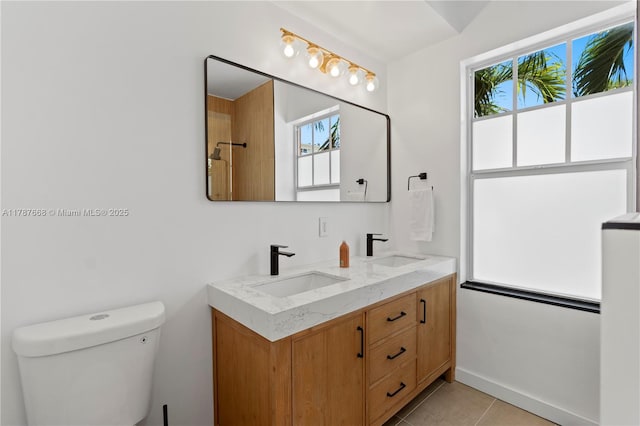 760 Meridian Ave Unit 1, Miami Beach, FL 33139 - bathroom featuring tile patterned flooring, a sink, double vanity, and toilet