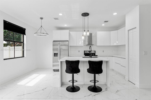 4814 NW 56th Ct, Tamarac, FL 33319 - kitchen featuring appliances with stainless steel finishes, modern cabinets, wall chimney range hood, and recessed lighting