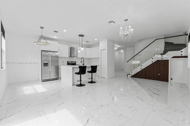 4814 NW 56th Ct, Tamarac, FL 33319 - unfurnished living room featuring a sink, a chandelier, baseboards, recessed lighting, and light marble finish flooring