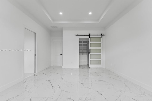4814 NW 56th Ct, Tamarac, FL 33319 - unfurnished bedroom with recessed lighting, a barn door, marble finish floors, a tray ceiling, and baseboards