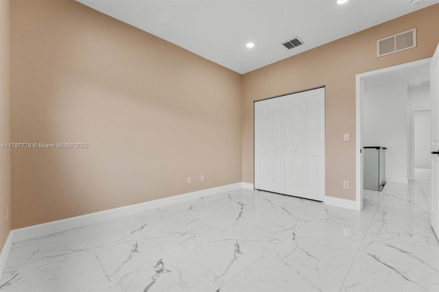 4814 NW 56th Ct, Tamarac, FL 33319 - unfurnished bedroom featuring baseboards, light marble finish floors, recessed lighting, and a closet