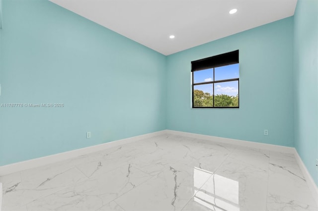4814 NW 56th Ct, Tamarac, FL 33319 - unfurnished room with baseboards, marble finish floors, and recessed lighting