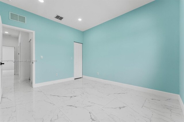 4814 NW 56th Ct, Tamarac, FL 33319 - spare room featuring baseboards, recessed lighting, and marble finish flooring