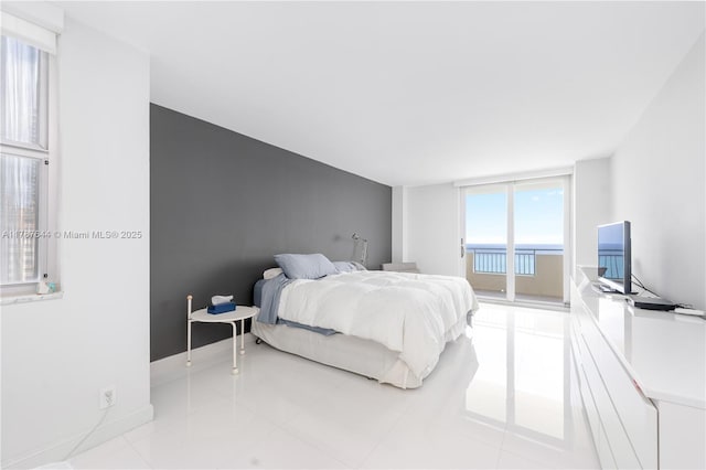 3180 S Ocean Dr Unit 1608, Hallandale Beach, FL 33009 - tiled bedroom with baseboards and access to exterior