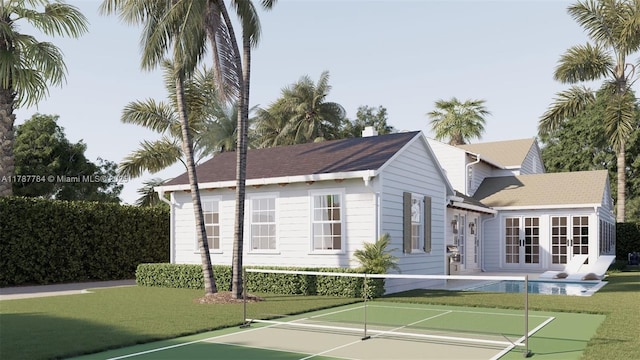 3609 Washington Rd, West Palm Beach, FL 33405 - view of tennis court with a lawn, french doors, and a pool