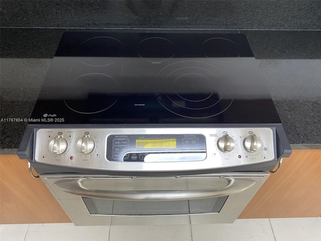 18800 NE 29th Ave Unit 1028, Aventura, FL 33180 - details with stainless steel range with electric cooktop