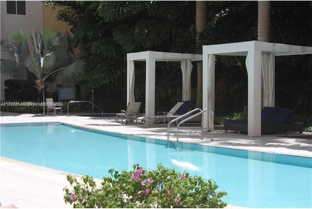 18800 NE 29th Ave Unit 1028, Aventura, FL 33180 - community pool featuring a patio
