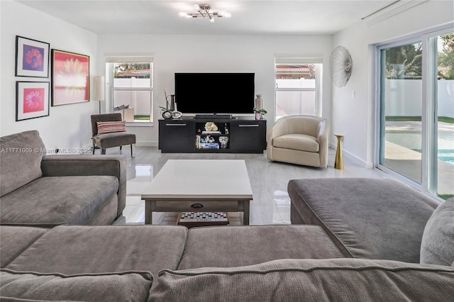 1990 NE 35th St, Lighthouse Point, FL 33064 - living area featuring wood finished floors and baseboards