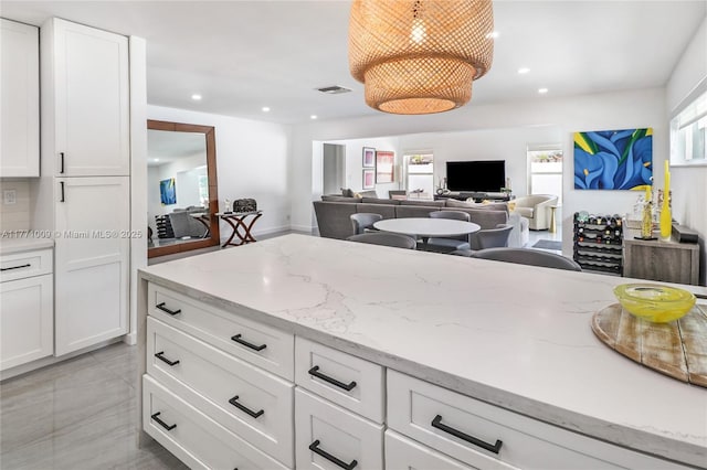 1990 NE 35th St, Lighthouse Point, FL 33064 - kitchen featuring recessed lighting and white cabinetry