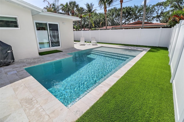 1990 NE 35th St, Lighthouse Point, FL 33064 - view of swimming pool featuring a fenced backyard, a yard, a patio, and a fenced in pool