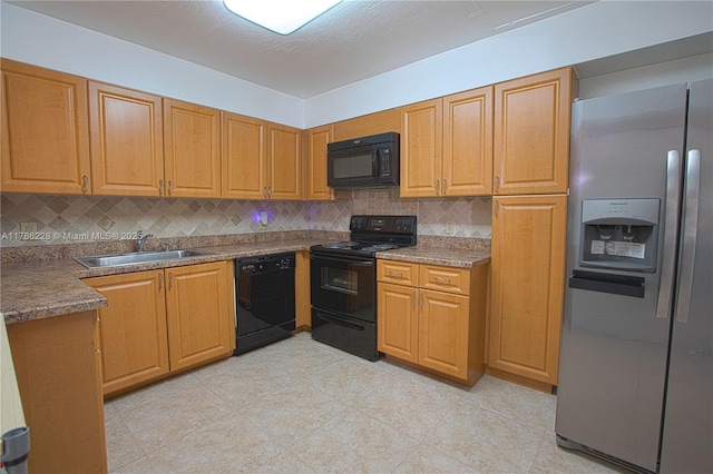 kitchen featuring backsplash, light tile patterned flooring, a sink, and black appliances