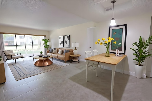 living room with baseboards and visible vents