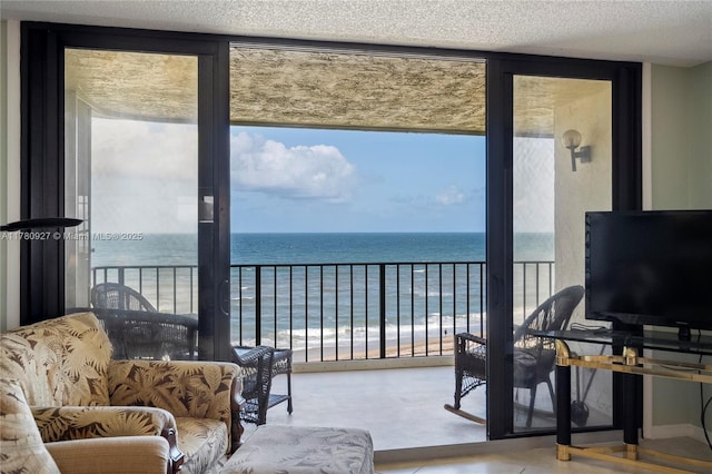 10000 S Ocean Dr Unit 703, Jensen Beach, FL 34957 - living room with floor to ceiling windows and a textured ceiling