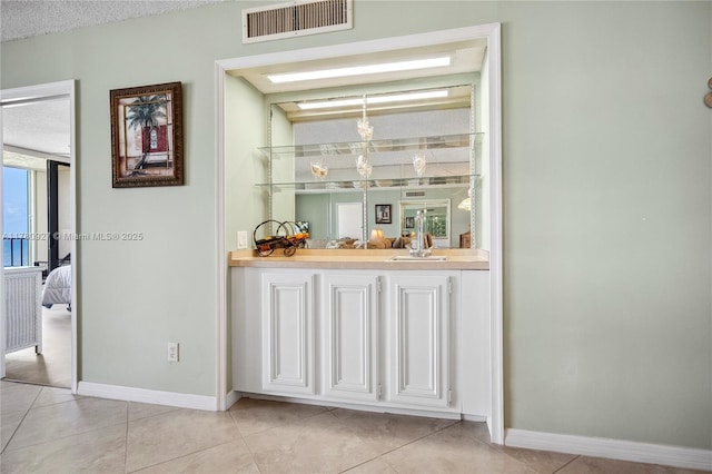 10000 S Ocean Dr Unit 703, Jensen Beach, FL 34957 - indoor bar with baseboards and light tile patterned flooring