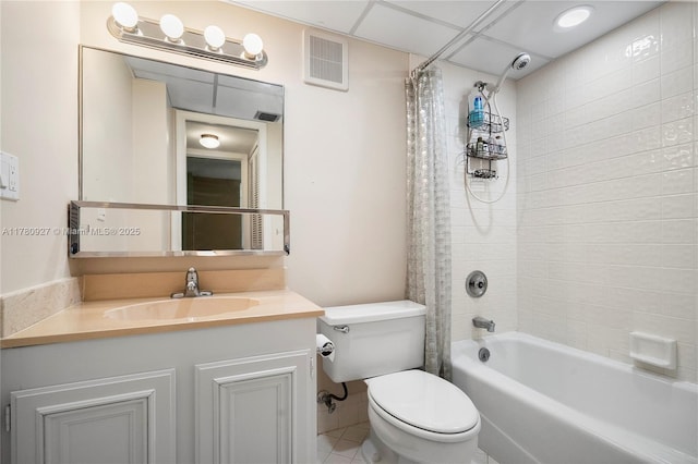 10000 S Ocean Dr Unit 703, Jensen Beach, FL 34957 - full bath featuring toilet, shower / bath combination with curtain, vanity, and tile patterned floors