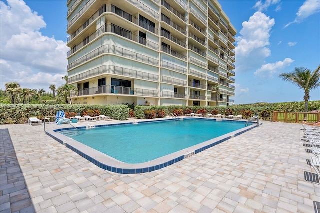 10000 S Ocean Dr Unit 703, Jensen Beach, FL 34957 - community pool featuring a patio