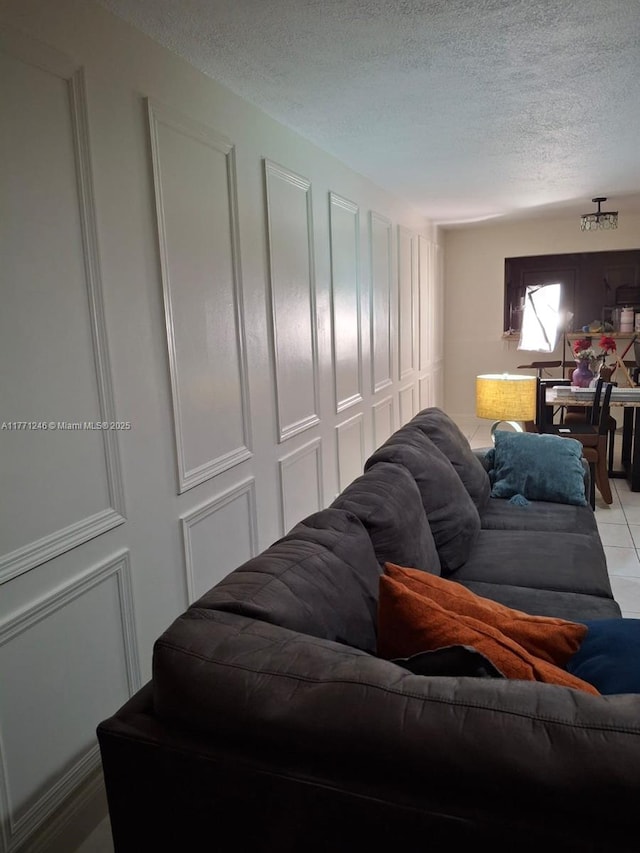 6101 N Falls Circle Dr Unit 312, Lauderhill, FL 33319 - living room with a textured ceiling and light tile patterned flooring