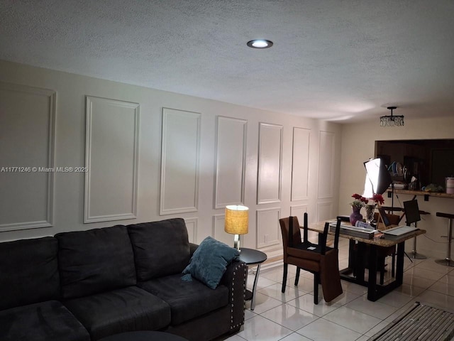6101 N Falls Circle Dr Unit 312, Lauderhill, FL 33319 - living room featuring a textured ceiling