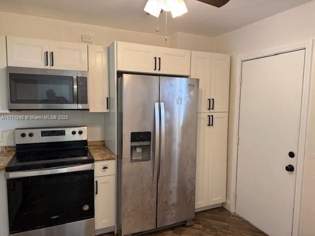 6101 N Falls Circle Dr Unit 312, Lauderhill, FL 33319 - kitchen featuring stainless steel appliances, white cabinets, a ceiling fan, dark wood finished floors, and light stone countertops