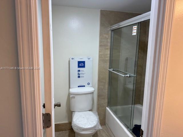 6101 N Falls Circle Dr Unit 312, Lauderhill, FL 33319 - full bath featuring toilet and combined bath / shower with glass door