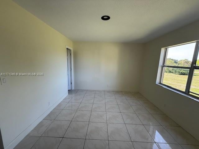 6101 N Falls Circle Dr Unit 312, Lauderhill, FL 33319 - unfurnished room with light tile patterned floors