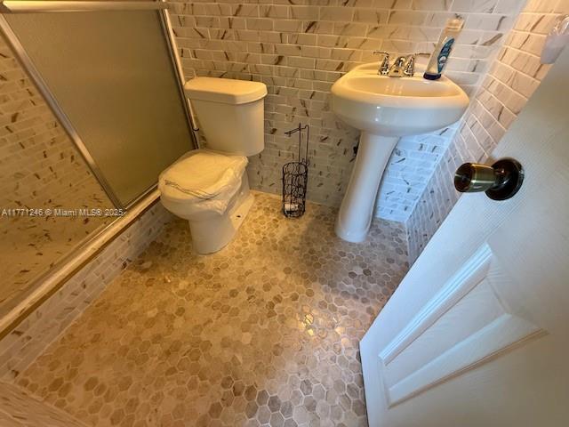 6101 N Falls Circle Dr Unit 312, Lauderhill, FL 33319 - bathroom with a shower stall and toilet