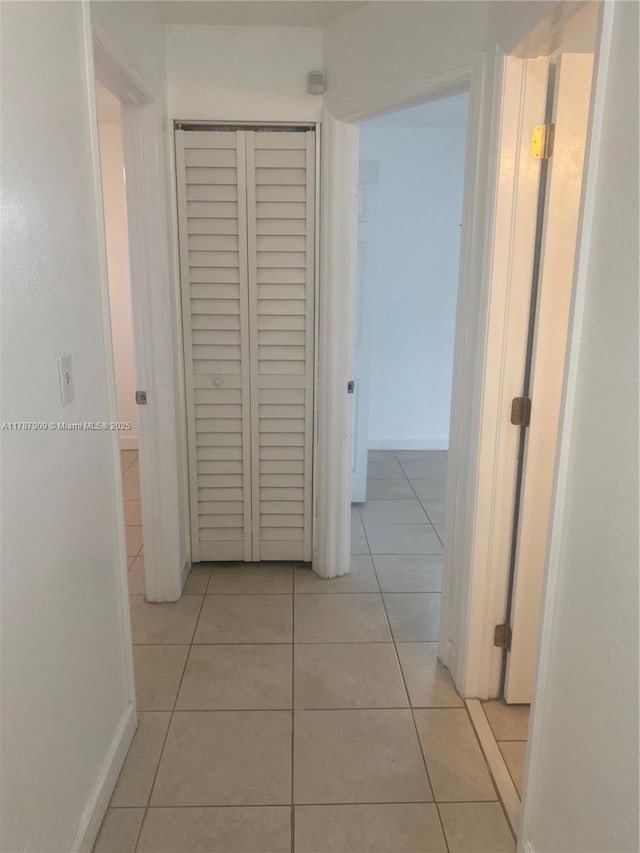 18714 SW 306th Ter, Homestead, FL 33030 - corridor featuring light tile patterned floors and baseboards