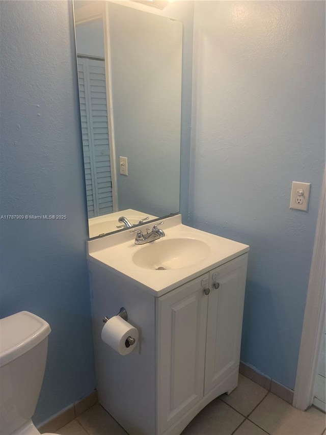 18714 SW 306th Ter, Homestead, FL 33030 - half bath with toilet, vanity, tile patterned flooring, and baseboards