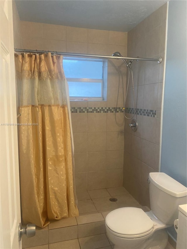 18714 SW 306th Ter, Homestead, FL 33030 - bathroom with a tile shower, toilet, tile patterned floors, and vanity