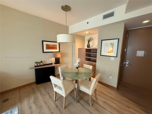 1395 Brickell Ave Unit 3211, Miami, FL 33131 - dining area with light wood-style floors