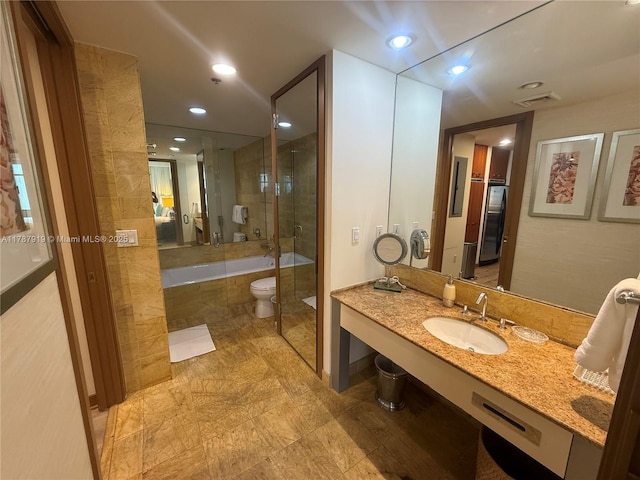 1395 Brickell Ave Unit 3211, Miami, FL 33131 - bathroom with tiled tub, vanity, a shower, and recessed lighting