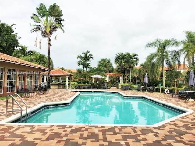 pool featuring a gazebo and a patio