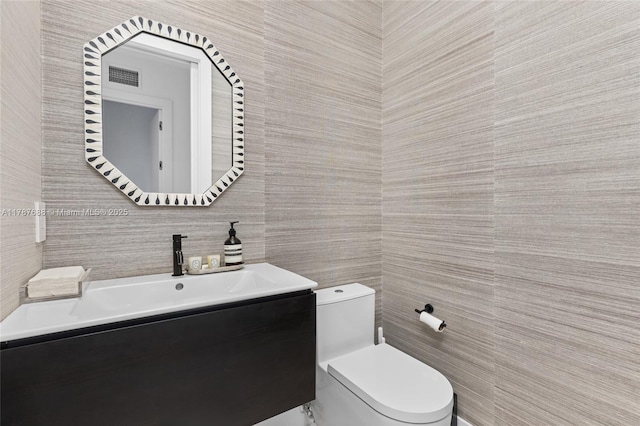 4039 Ventura Ave, Miami, FL 33133 - bathroom with tile walls, visible vents, vanity, and toilet
