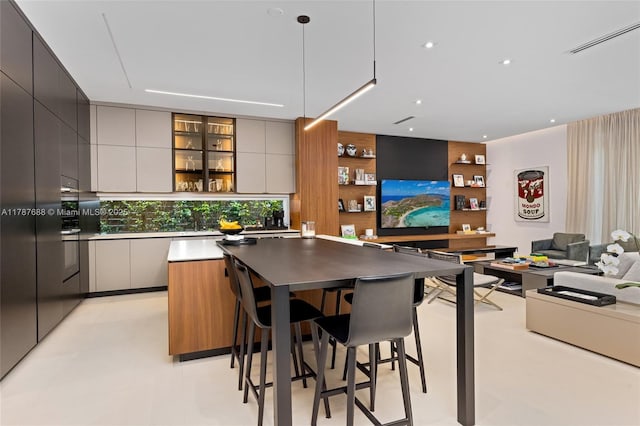 4039 Ventura Ave, Miami, FL 33133 - bar with pendant lighting, a sink, and visible vents
