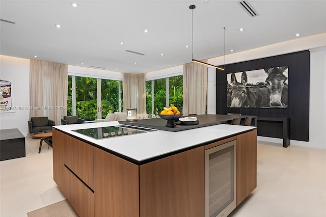 4039 Ventura Ave, Miami, FL 33133 - kitchen with open floor plan, beverage cooler, modern cabinets, black electric stovetop, and a kitchen island