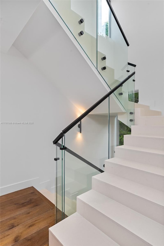4039 Ventura Ave, Miami, FL 33133 - staircase featuring wood finished floors and baseboards