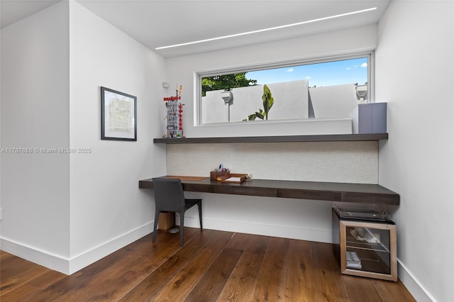 4039 Ventura Ave, Miami, FL 33133 - unfurnished office with wood-type flooring, baseboards, and built in desk