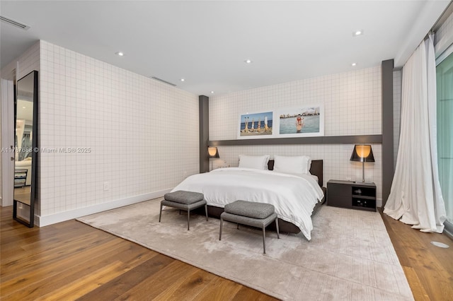 4039 Ventura Ave, Miami, FL 33133 - bedroom with wallpapered walls, wood finished floors, and visible vents