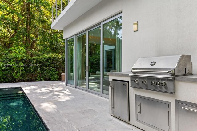 4039 Ventura Ave, Miami, FL 33133 - view of patio with an outdoor pool and area for grilling