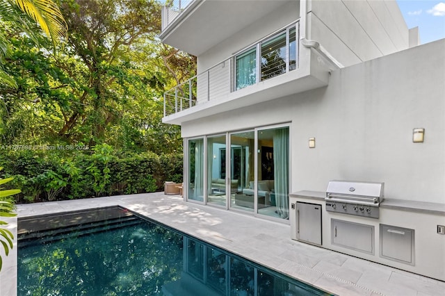 4039 Ventura Ave, Miami, FL 33133 - exterior space with a patio, a balcony, area for grilling, an outdoor pool, and stucco siding