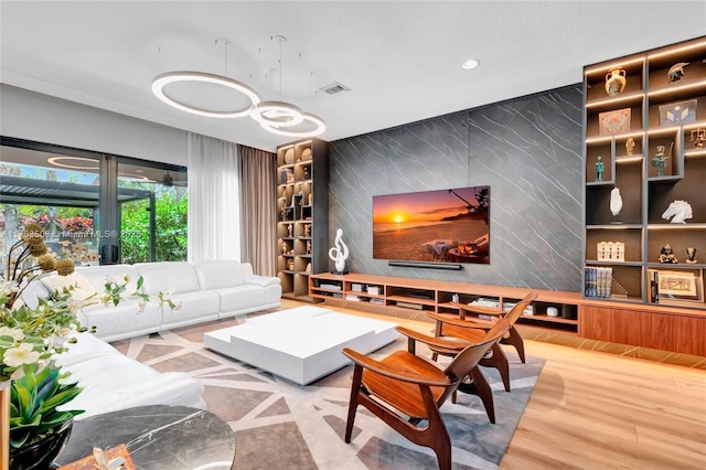 8608 Torrey Isles Ter, Boca Raton, FL 33496 - living area with an accent wall and recessed lighting