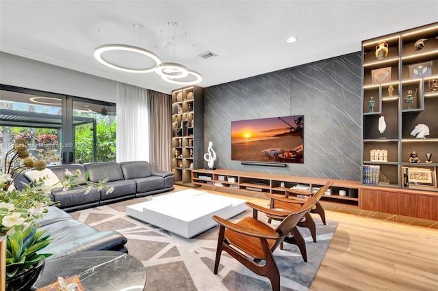 8608 Torrey Isles Ter, Boca Raton, FL 33496 - living room with an accent wall, recessed lighting, and wood finished floors