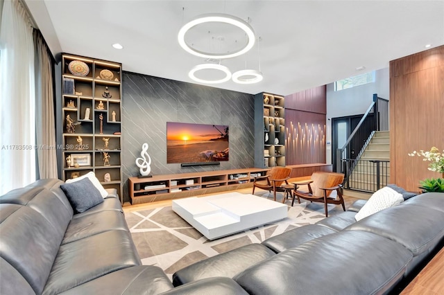 8608 Torrey Isles Ter, Boca Raton, FL 33496 - living area with an accent wall, recessed lighting, and stairway