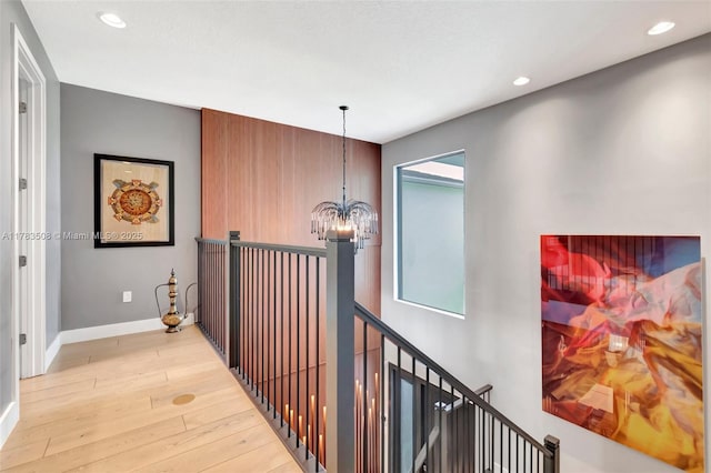 8608 Torrey Isles Ter, Boca Raton, FL 33496 - corridor featuring an upstairs landing, a chandelier, light wood finished floors, recessed lighting, and healthy amount of natural light
