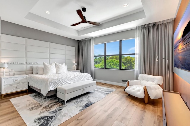 8608 Torrey Isles Ter, Boca Raton, FL 33496 - bedroom with a tray ceiling, recessed lighting, wood finished floors, and ceiling fan