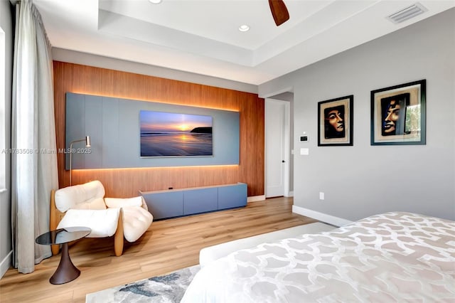 8608 Torrey Isles Ter, Boca Raton, FL 33496 - bedroom with wood finished floors, wooden walls, a raised ceiling, ceiling fan, and recessed lighting