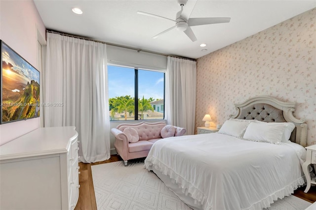 8608 Torrey Isles Ter, Boca Raton, FL 33496 - bedroom with recessed lighting, wallpapered walls, light wood-style flooring, and a ceiling fan