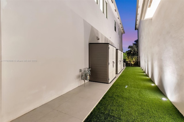 8608 Torrey Isles Ter, Boca Raton, FL 33496 - view of property exterior featuring stucco siding and a lawn