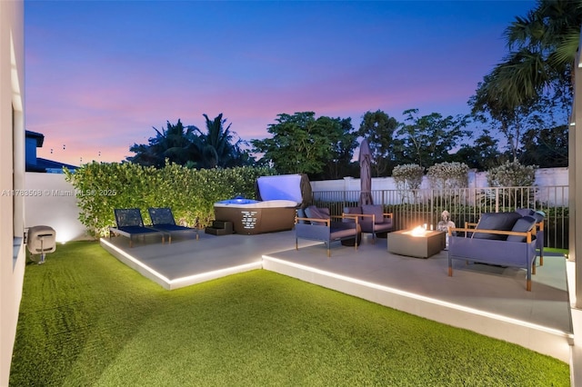 8608 Torrey Isles Ter, Boca Raton, FL 33496 - yard at dusk with a patio and an outdoor living space with a fire pit